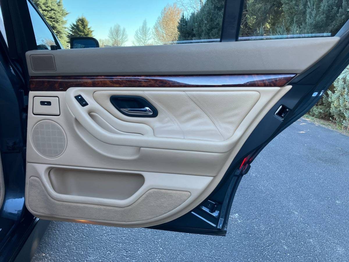 Door panel: clean leather and intact wood trim